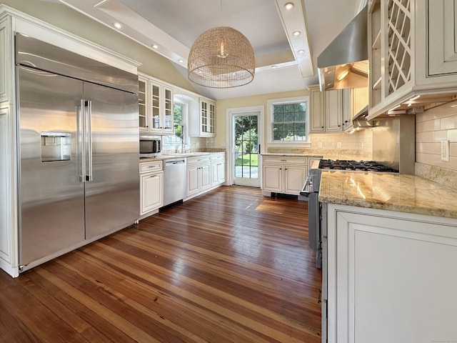 14 W Mystic Ave, Groton, CT 06355 - kitchen with stainless steel appliances, dark wood finished floors, wall chimney range hood, light stone countertops, and recessed lighting