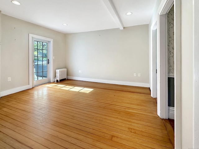 14 W Mystic Ave, Groton, CT 06355 - spare room featuring radiator heating unit, baseboards, light wood-type flooring, recessed lighting, and beamed ceiling