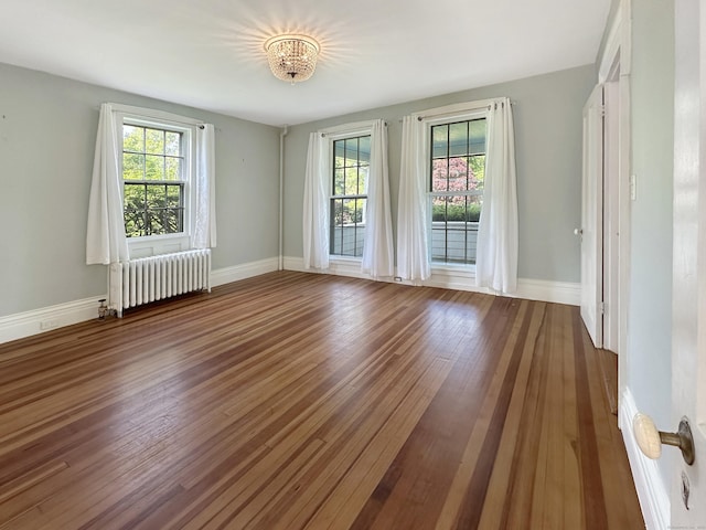 14 W Mystic Ave, Groton, CT 06355 - unfurnished room featuring radiator heating unit, baseboards, and wood finished floors