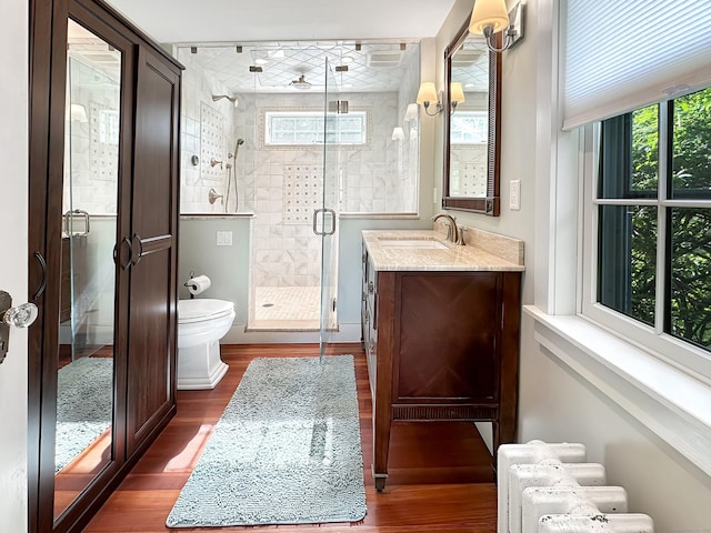 14 W Mystic Ave, Groton, CT 06355 - full bathroom with toilet, wood finished floors, vanity, and a shower stall