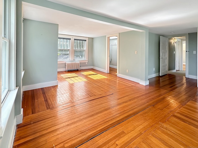 14 W Mystic Ave, Groton, CT 06355 - spare room featuring radiator, hardwood / wood-style floors, and baseboards