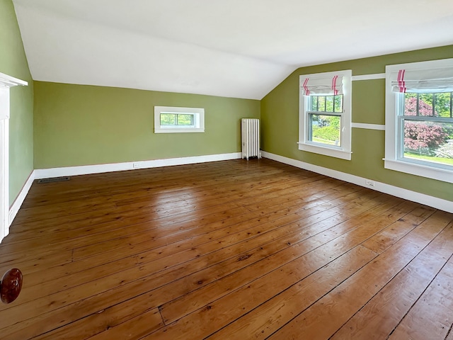 14 W Mystic Ave, Groton, CT 06355 - additional living space featuring radiator heating unit, lofted ceiling, wood-type flooring, and baseboards