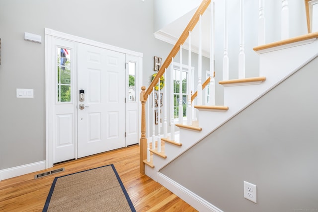 9 Tall Wood Dr, East Hampton, CT 06424 - entryway with stairs, plenty of natural light, wood finished floors, and baseboards