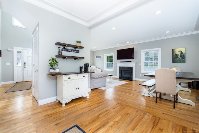 9 Tall Wood Dr, East Hampton, CT 06424 - living area featuring light wood finished floors, crown molding, a fireplace with flush hearth, recessed lighting, and baseboards
