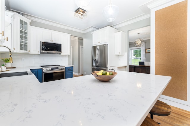 9 Tall Wood Dr, East Hampton, CT 06424 - kitchen featuring appliances with stainless steel finishes, a sink, baseboards, tasteful backsplash, and glass insert cabinets