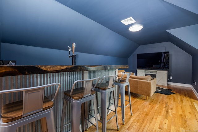 9 Tall Wood Dr, East Hampton, CT 06424 - home theater featuring vaulted ceiling, light wood-style floors, baseboards, and bar area