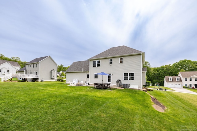 9 Tall Wood Dr, East Hampton, CT 06424 - rear view of property featuring a yard and central AC unit