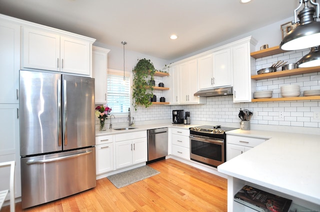 35 Ringgold St Unit 401, West Hartford, CT 06119 - kitchen featuring open shelves, appliances with stainless steel finishes, under cabinet range hood, a sink, and light countertops