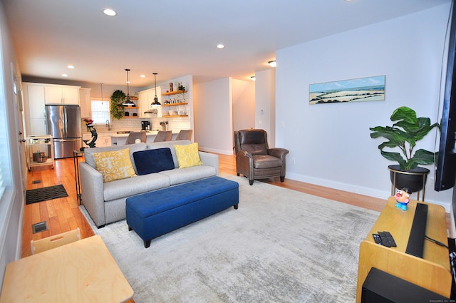 35 Ringgold St Unit 401, West Hartford, CT 06119 - living area with light wood finished floors, recessed lighting, and baseboards