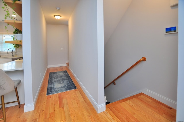 35 Ringgold St Unit 401, West Hartford, CT 06119 - hallway with an upstairs landing, light wood-type flooring, and a sink