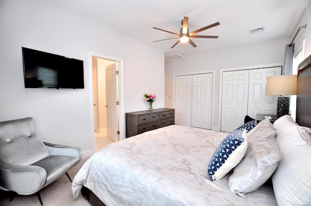 35 Ringgold St Unit 401, West Hartford, CT 06119 - bedroom featuring two closets, light colored carpet, ensuite bathroom, a ceiling fan, and baseboards