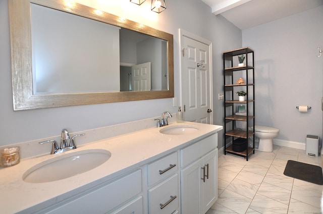 35 Ringgold St Unit 401, West Hartford, CT 06119 - bathroom featuring marble look tiles, double vanity, toilet, and baseboards