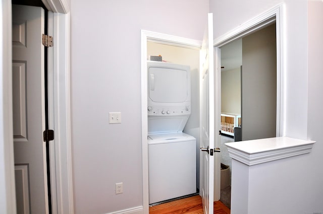 35 Ringgold St Unit 401, West Hartford, CT 06119 - laundry room with estacked washer and dryer and wood finished floors