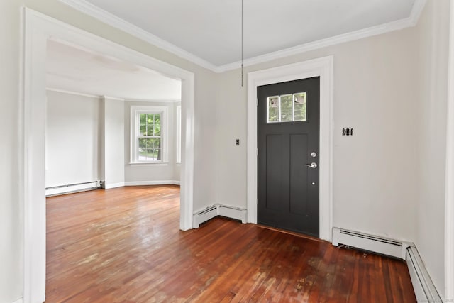 27 Maple St, Berlin, CT 06037 - foyer with baseboard heating, hardwood / wood-style flooring, crown molding, and a baseboard radiator