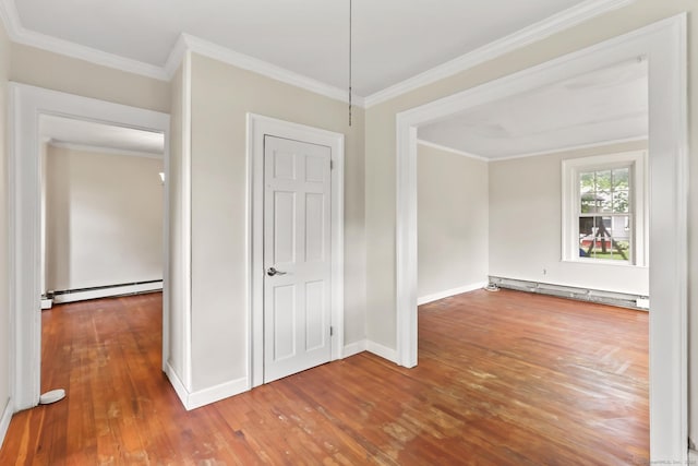 27 Maple St, Berlin, CT 06037 - empty room featuring baseboard heating, wood-type flooring, baseboards, and crown molding
