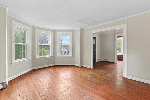 27 Maple St, Berlin, CT 06037 - unfurnished room featuring ornamental molding, healthy amount of natural light, baseboard heating, and baseboards