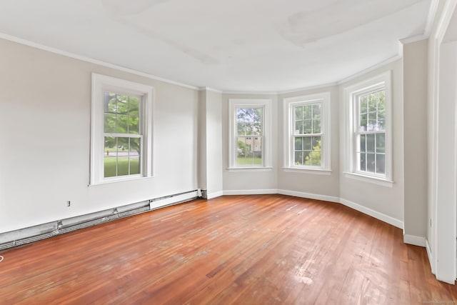 27 Maple St, Berlin, CT 06037 - empty room featuring crown molding, baseboards, light wood-style floors, and a baseboard radiator