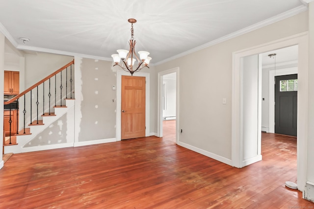 27 Maple St, Berlin, CT 06037 - unfurnished room featuring crown molding, wood finished floors, a chandelier, stairway, and baseboards