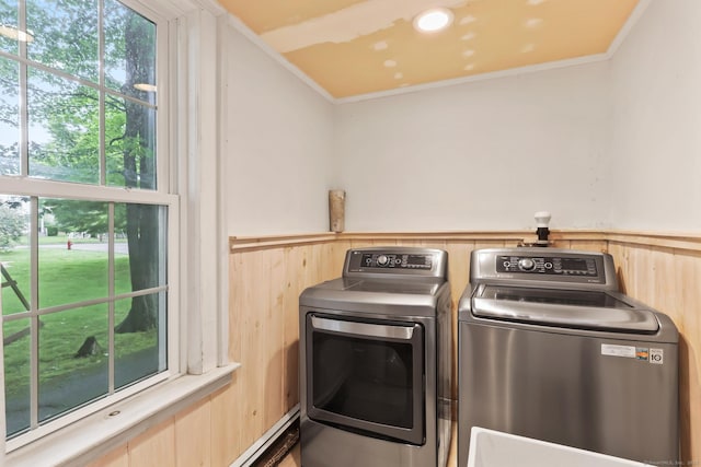 27 Maple St, Berlin, CT 06037 - washroom with washer and clothes dryer, a wainscoted wall, crown molding, and wooden walls