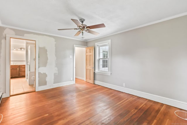 27 Maple St, Berlin, CT 06037 - unfurnished bedroom with baseboards, hardwood / wood-style floors, ornamental molding, connected bathroom, and ceiling fan