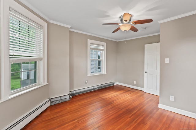 27 Maple St, Berlin, CT 06037 - spare room with baseboard heating, wood finished floors, a ceiling fan, baseboards, and crown molding