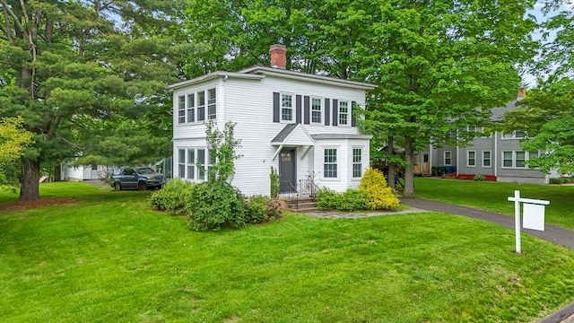 27 Maple St, Berlin, CT 06037 - view of front of property with a chimney and a front lawn