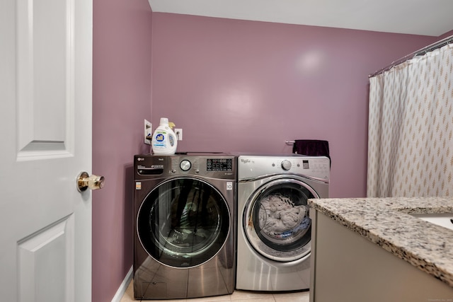 2118 Meriden Waterbury Tpke Unit 18, Southington, CT 06444 - washroom with washing machine and clothes dryer and light tile patterned floors