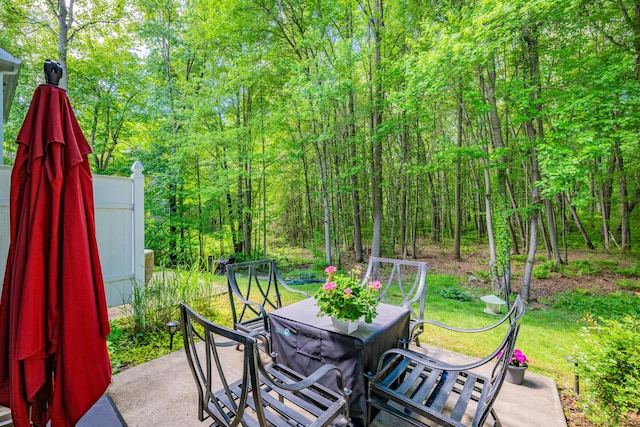 2118 Meriden Waterbury Tpke Unit 18, Southington, CT 06444 - view of patio with outdoor dining space and a wooded view