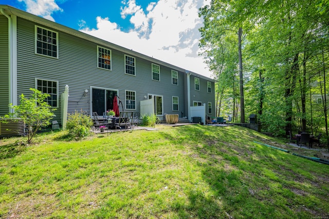 2118 Meriden Waterbury Tpke Unit 18, Southington, CT 06444 - back of property with a lawn and a patio