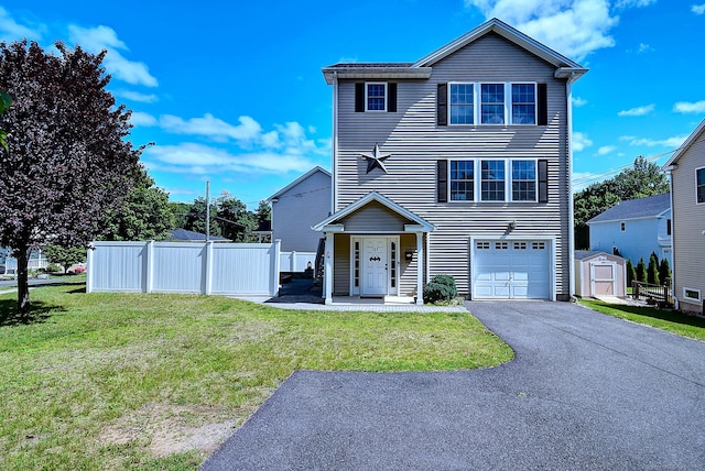 105 Scott St, Naugatuck, CT 06770 - view of front facade with a garage and asphalt driveway
