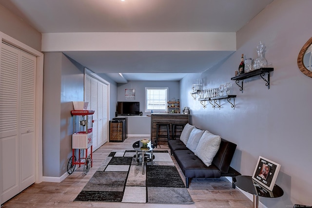105 Scott St, Naugatuck, CT 06770 - living room with wood finished floors, baseboards, and a dry bar