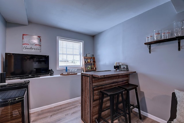 105 Scott St, Naugatuck, CT 06770 - bar area featuring wood finished floors and baseboards