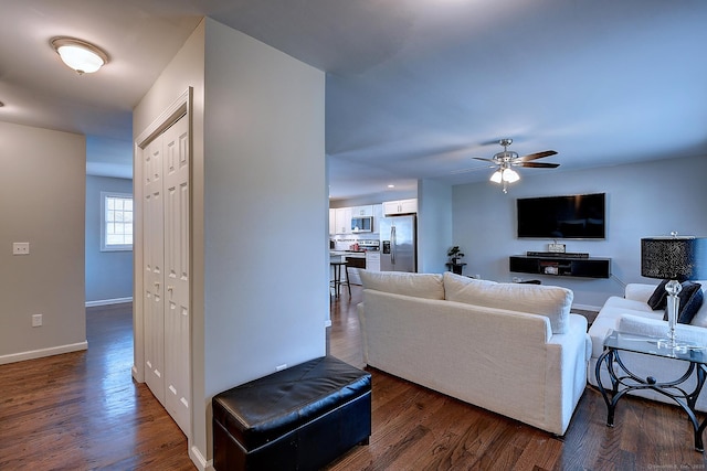 105 Scott St, Naugatuck, CT 06770 - living area with a ceiling fan, dark wood-style flooring, and baseboards