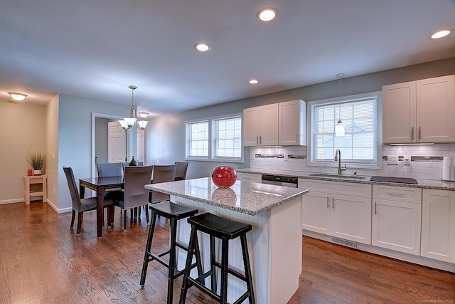 105 Scott St, Naugatuck, CT 06770 - kitchen with a sink, a chandelier, white cabinets, dishwasher, and recessed lighting