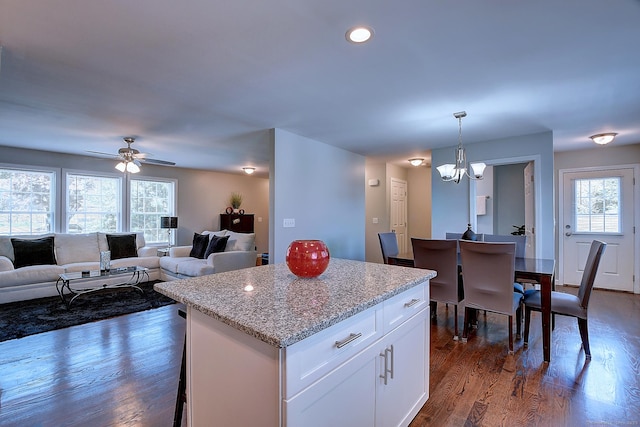 105 Scott St, Naugatuck, CT 06770 - kitchen with a chandelier, white cabinets, a center island, dark wood finished floors, and decorative light fixtures