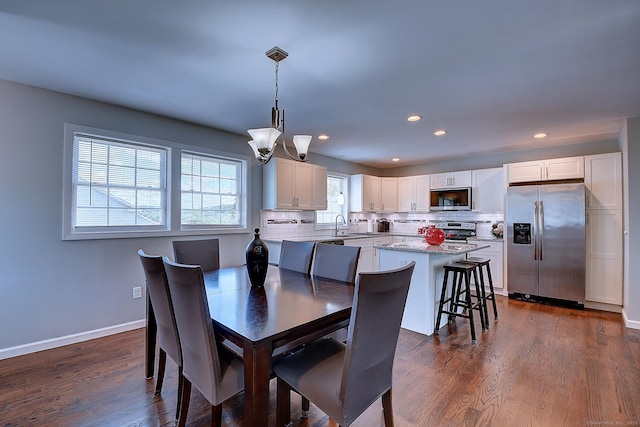 105 Scott St, Naugatuck, CT 06770 - dining room featuring a chandelier, recessed lighting, dark wood-style flooring, and baseboards