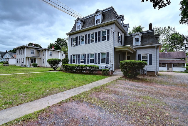 34 Woodbridge St, Manchester, CT 06042 - victorian home featuring mansard roof, a front yard, and a chimney