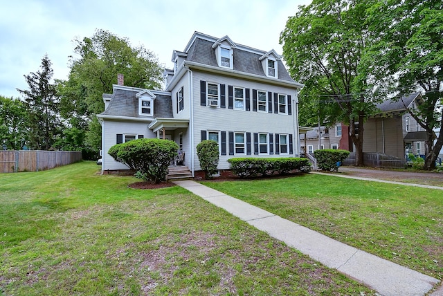 34 Woodbridge St, Manchester, CT 06042 - second empire-style home featuring mansard roof and a chimney