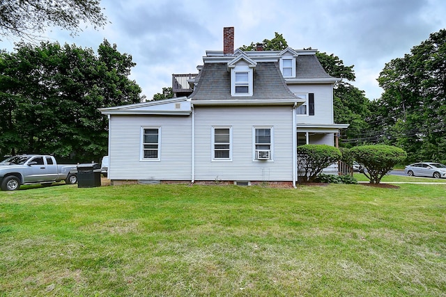 34 Woodbridge St, Manchester, CT 06042 - rear view of property with a chimney, mansard roof, and a lawn