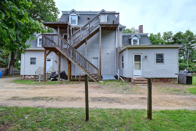 34 Woodbridge St, Manchester, CT 06042 - rear view of property featuring stairway, entry steps, a chimney, and a wooden deck
