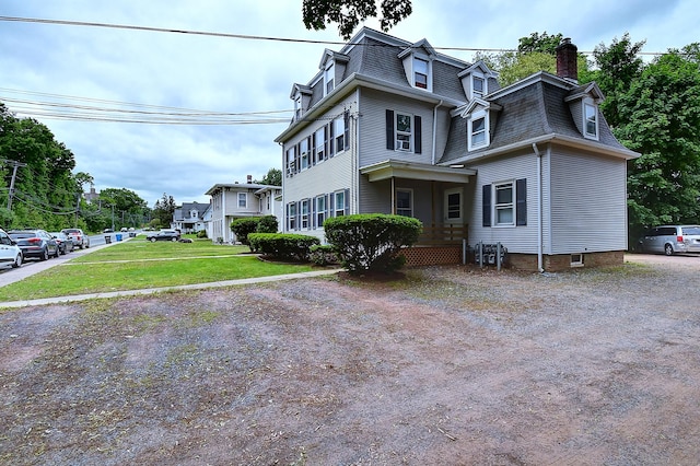 34 Woodbridge St, Manchester, CT 06042 - second empire-style home with mansard roof, a chimney, and a front lawn
