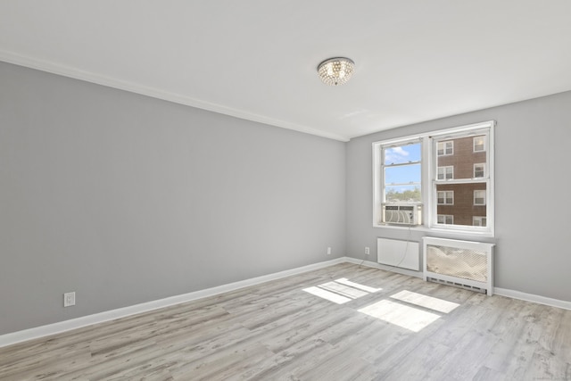 39 Glenbrook Rd Apt 2A, Stamford, CT 06902 - unfurnished room with light wood-style flooring, heating unit, baseboards, and a chandelier