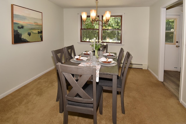 169 Brookfield St, South Windsor, CT 06074 - dining area featuring light colored carpet, a chandelier, baseboards, and a baseboard heating unit