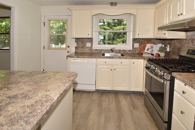 169 Brookfield St, South Windsor, CT 06074 - kitchen with stainless steel gas range oven, white dishwasher, under cabinet range hood, a sink, and backsplash