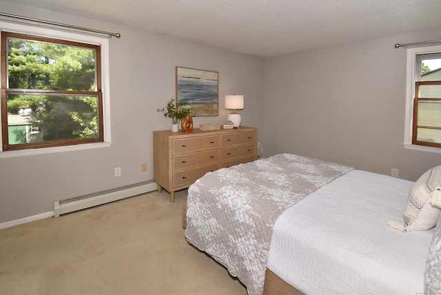 169 Brookfield St, South Windsor, CT 06074 - bedroom with a baseboard heating unit, light colored carpet, and baseboards