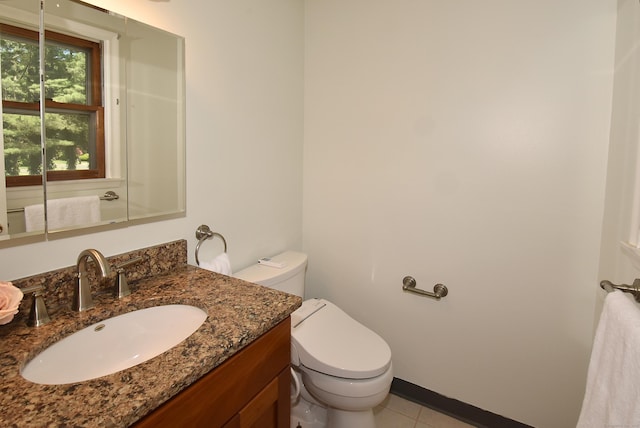 169 Brookfield St, South Windsor, CT 06074 - bathroom with toilet, tile patterned flooring, and vanity