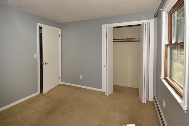 169 Brookfield St, South Windsor, CT 06074 - unfurnished bedroom with light carpet, a baseboard heating unit, a textured ceiling, a closet, and baseboards