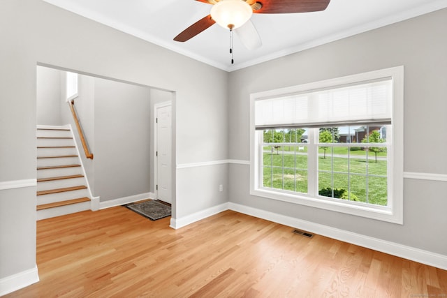 584 Meriden Ave Unit 1, Southington, CT 06489 - spare room featuring light wood-type flooring, ceiling fan, baseboards, stairs, and crown molding