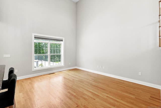 584 Meriden Ave Unit 1, Southington, CT 06489 - spare room featuring light wood finished floors, baseboards, and a high ceiling