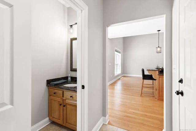 584 Meriden Ave Unit 1, Southington, CT 06489 - corridor featuring light wood-style floors, baseboards, and a sink